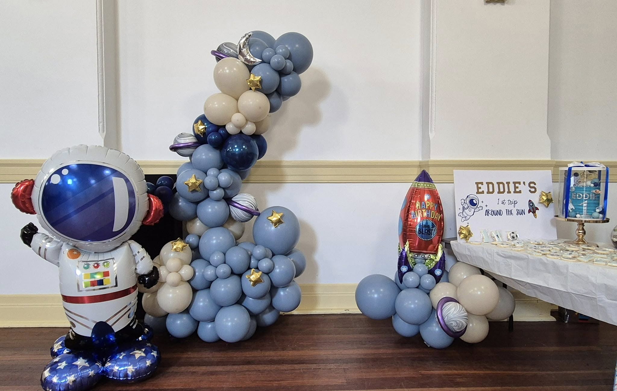 Space themed birthday with a large astronaut balloon feature