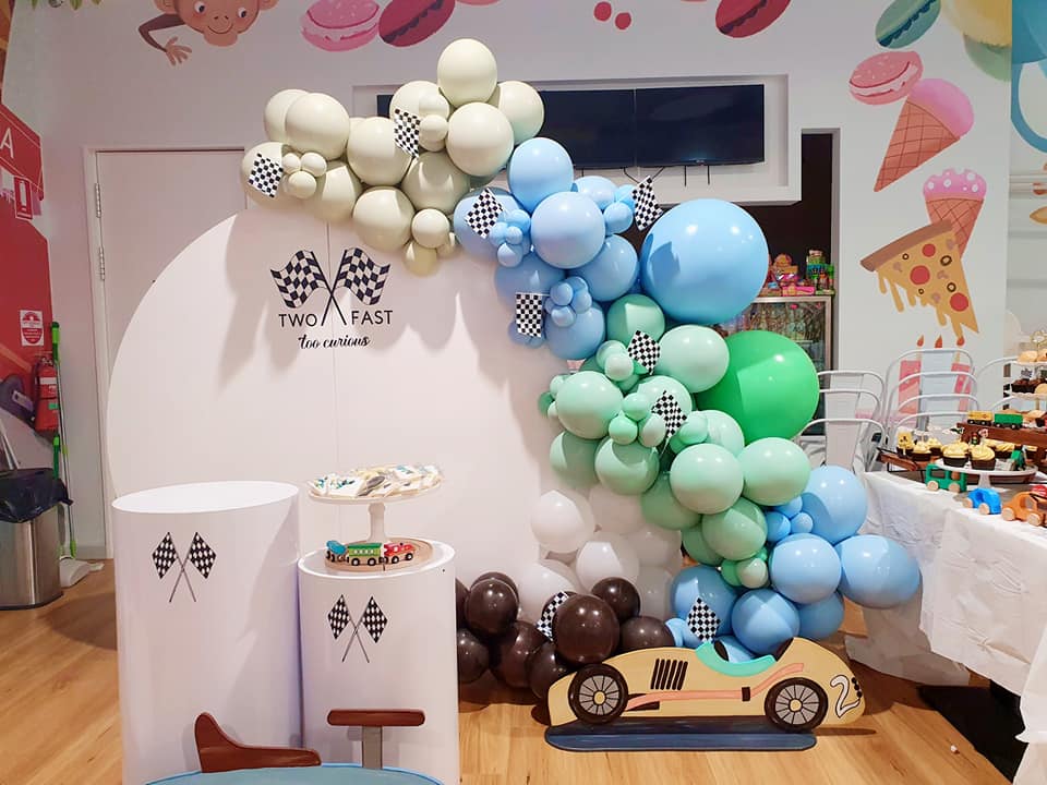 Race car themed children's party with centrepiece, plaque, and model car